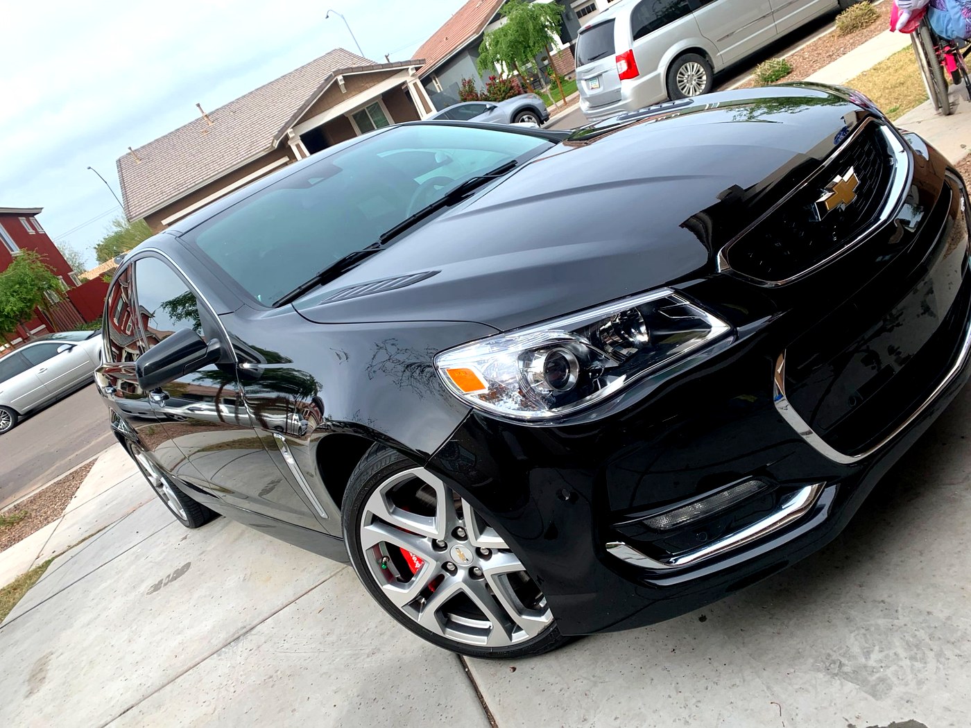 Exterior paint polish result — Chevy SS deep black mirror finish after polish